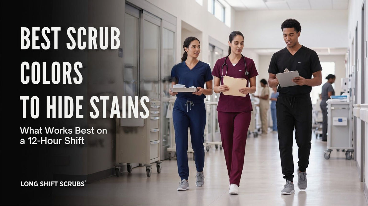 Three healthcare workers walking down a hospital hallway wearing navy, burgundy, and black scrubs.